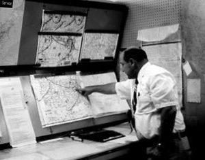 00-00-0000 Man pointing to a map. Photo by Robert Mills