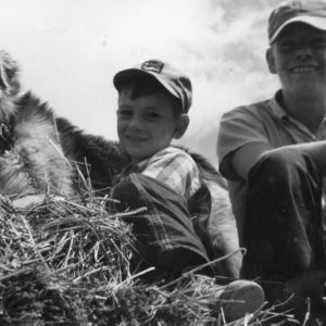 00-00-0000 Two boys and dog atop bales of hay-Photo by Robert Mills