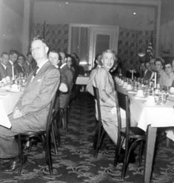 02-06-1954 Two dinner tables of people. Perhaps Annual Meeting Photo by Robert Mills