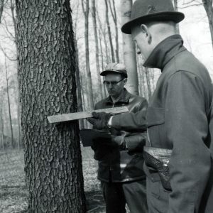 03-16-1965 Dean Swigert,Wm.Sauerwein. Measuring volume of logs in a standing tree-0001