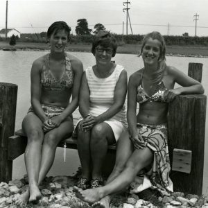 07-15-1975 Mrs. Metzger and daughters at half acre pond belonging to the family-website
