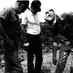 07-17-1975 Dan Cooper and George Smith and Dean Swigart viewing pipe at Bill Evans Pond-website
