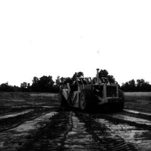 07-18-1975 Fred Slessman and 4 wheel drive self-loading scraper on pan at Vernon Rapps Pond-website
