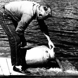 09-08-1966 Everett Donough stocks fingerling bass at the Woods and Water Christian retreat pond-website