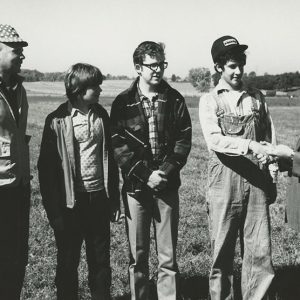 1970s Land Judging. Man giving award to group #1-Website