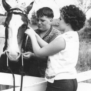 Boy and girl with horse .Photo by Robert Mills