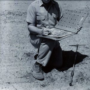 C.E.Redmon.Soil Scientist, plots soil bondaries on an aerial photo after examining the soil-0001
