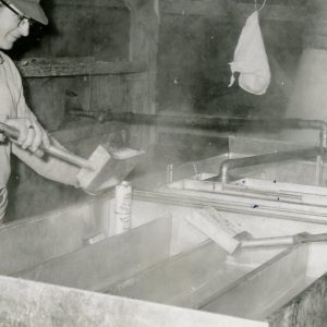 Making Maple Syrup-Filling a container (photo by Robert Mills)