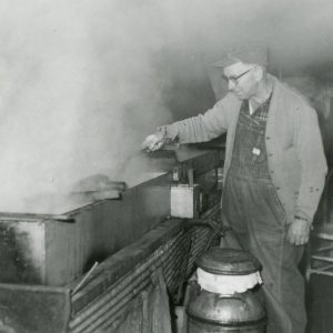 Making Maple Syrup- Stirring Syrup (photo by Robert Mills)-013
