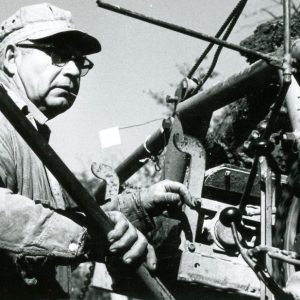 Man at controls of some machine. -0001.Photo by Robert Mills