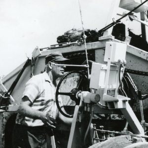 Man at controls of some machine. -0002.Photo by Robert Mills