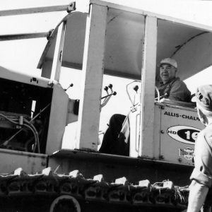 Man at driver’s seat in huge machine .Photo by Robert Mills