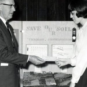 Student receving check at Science Fair(Photo by Robert Mills)