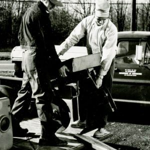 Two Men Unloading the tree planter (photo by Robert Mills)