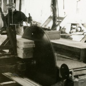 Working Inside a Sawmill. Photo by Robert Mills