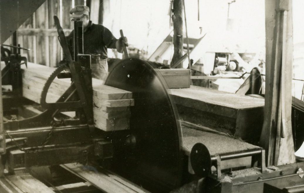 Working Inside a Sawmill. Photo by Robert Mills
