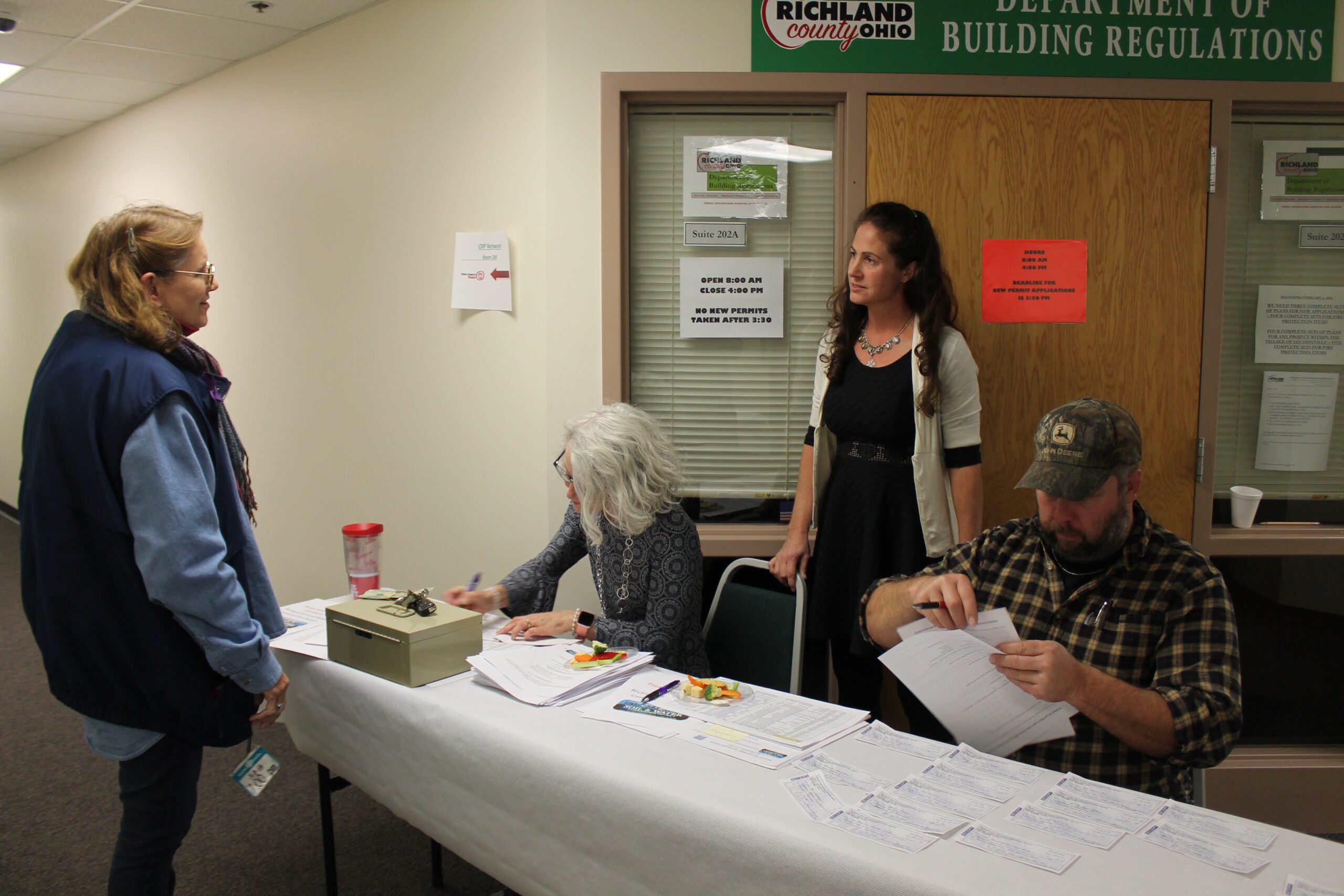McClintock, Jean in front of table; L to R Sutter, Theresa, Thomas, Erica, Wallace, Matt Richland SWCD