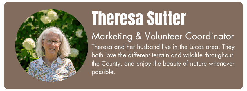Photo of Theresa Sutter, Marketing & Volunteer Coordinator. Her bio reads "Theresa and her husband live in the Lucas area. They both love the different terrain and wildlife throughout the County, and enjoy the beauty of nature whenever possible."