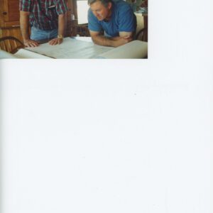 Gary Mathes and Tom Miller Looking at Plans for an Animal Waste Composte Facility