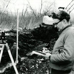 January 16, 1969. Dean Swigart, SCS Technician, as he checks out the Holmes Group Open DItch. Robert Wilson with the rod.