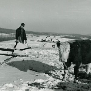 February 16, 1970. Ralph Winters uses a snowmobile to check his cattle on winter range.