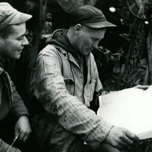 April 12, 1965 Left to Right: Dale Cook (Farm Operator) and Ed Allgire (Tile Drainage Contractor) at the Mrs. Nina Reed Farm