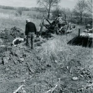 April 19, 1967 Steve Phillips, Chester Hampton, and John Phillips Installing Tile Drainage