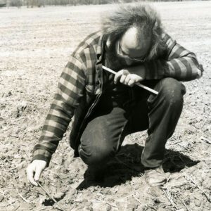 April 21, 1980 Lanny Hopkins checks the soil temperature