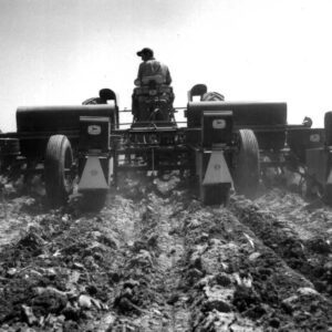May 16, 1963 Ted Putt operating an insecticide sprayer