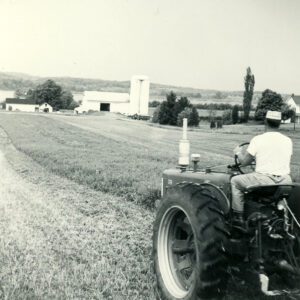 May 24, 1965. A man on a tractor.