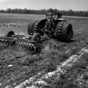 May 27, 1967 Tom Putt on a Tractor Working in a Farm Field