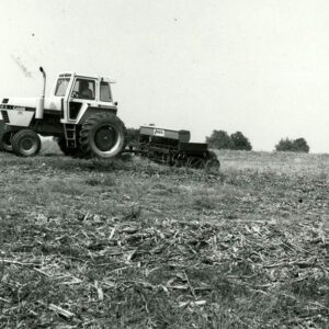 May 27, 1980 Don Garrison plants no-till soybeans in corn stalks Using a Moore Drill