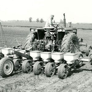 June 4, 1971 Laurence Faulkner at Lowell Strauch Farm, 8 row, 20-inch Oliver drill corn planter.