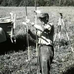 July 28, 1976 Leonard Kreitemeyer Surveying a Farm Field