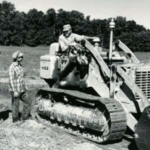 September 6, 1966 Kenneth Strock, Kenneth Wise, Blake Kirsch in Farm Field with a Bulldozer. Open Waterway at Cedar Creek Ranch.