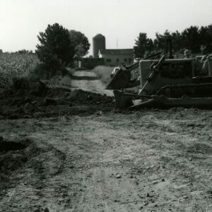 September 12, 1982 Unidentified equipment in a farm field getting ready to cross a driveway at the Carey Farm