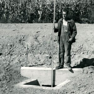 October 1, 1963. Jim Brinker on his property. Richland County. Newly completed drop inlet concrete outlet structure.