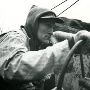 December 16, 1965 Ed Allgire, Tile Drainage Contractor, at the Sight Bar as he installed tile at the Mrs. Nina Reed Farm