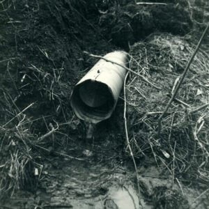 December 16, 1965 Water Running Out of a Drainage Pipe