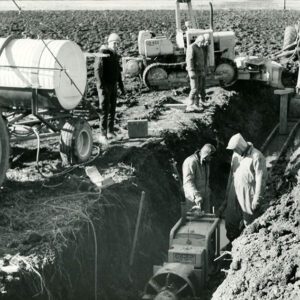 December 17, 1971 Ambrose Metzger at his farm as the crew completed boring 65 feet under the railroad so a 12 inch outlet drainage time can be installed
