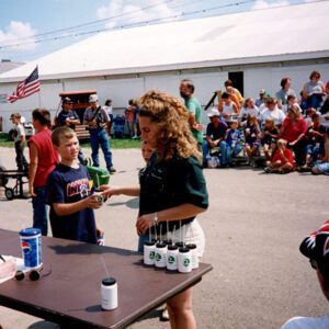 Two young people at sign-in table