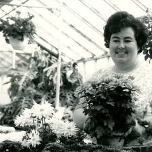 Woman_in_greenhouse_with_flowers_website-2860